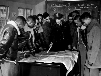 members-of-the-famed-tuskegee-airmen-looking-at-a-flight-map-during-a-training-class